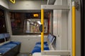 Yellow handrail and interior view inside passenger trains or light rail tram Royalty Free Stock Photo