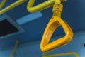 Yellow  hanging handhold for standing passengers in a modern bus. Suburban and urban transport Royalty Free Stock Photo