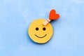 Yellow happy smiley face on a blue background Royalty Free Stock Photo