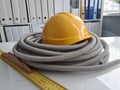 Yellow hard hat construction tool on table closeup Royalty Free Stock Photo
