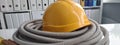 Yellow hard hat construction tool on table closeup Royalty Free Stock Photo
