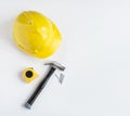 Yellow Hard Hat with Hammer, Tape Measure and Nails Royalty Free Stock Photo