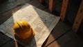 Yellow hard hat rests on architectural blueprints. Construction project design layout is on a wooden surface. Building work site Royalty Free Stock Photo