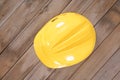 Yellow hard hat on the table Royalty Free Stock Photo