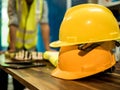 Yellow hard safety helmet hat for safety project of workman as engineer or worker, In the office, safety concept Royalty Free Stock Photo