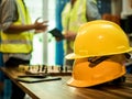 Yellow hard safety helmet hat for safety project of workman as engineer or worker, In the office, safety concept Royalty Free Stock Photo