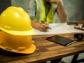 Yellow hard safety helmet hat for safety project of workman as engineer or worker, In the office, safety concept Royalty Free Stock Photo