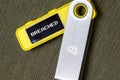 hardware Bitcoin wallet with breached message on screen Royalty Free Stock Photo