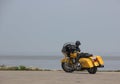 Yellow Harley Davidson motorcycle water back ground Royalty Free Stock Photo