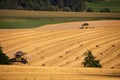 Yellow harvester combine on field harvesting gold wheat Royalty Free Stock Photo