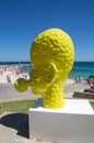 Yellow Head Sculpture: Blowing Bubble in Profile