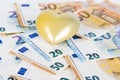 Yellow heart with Euro. euro banknotes. love and money