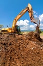 Yellow heavy duty industrial excavator working Royalty Free Stock Photo