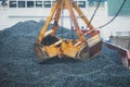 Yellow heavy excavator and bulldozer excavating sand and working during road works, unloading sand and road metal Royalty Free Stock Photo