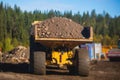 Yellow heavy excavator and dump tip truck tipper excavating sand and working during road works, unloading sand during construction Royalty Free Stock Photo