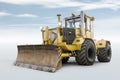 Yellow heavy wheeled tractor isolated on bright background