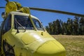 Yellow helicopter at base of operations