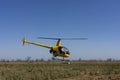 Yellow helicopter taking off. Royalty Free Stock Photo