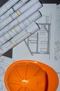 Yellow helmet, house keys and drawing tools on construction plans Royalty Free Stock Photo