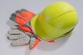 Yellow helmet work and protective gloves Royalty Free Stock Photo