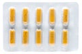 Yellow herb pills transparent gelatin capsule in blister pack