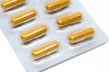 Yellow herb pills transparent gelatin capsule in blister pack