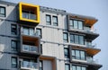 Yellow highlights in exterior of a condo building in Victoria do