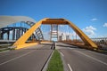 Yellow Hogeweidebrug suspension bridge in Utrecht with seperate lanes for traffic and for busses Royalty Free Stock Photo