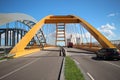 Yellow Hogeweidebrug suspension bridge in Utrecht with seperate lanes for traffic Royalty Free Stock Photo