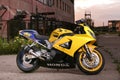 Yellow honda fireblade on the background of industrial landscape. Royalty Free Stock Photo