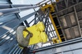 Yellow hook and chain of the factory bridge crane Royalty Free Stock Photo