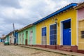 Yellow house with blue door and windows in Trinidad, Cuba