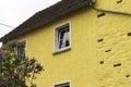 Yellow house with holes in Moselkern, Germany