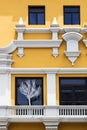 yellow house with large balcony