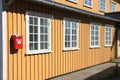 Yellow house with red mailbox