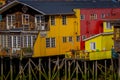 Yellow house on stilts palafitos in Castro, Chiloe Island, Patagonia