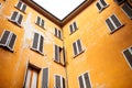 Yellow house walls in italian urban patio