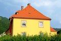 Yellow huse with red roof in Austria Royalty Free Stock Photo