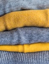 Yellow illuminated color and gray winter sweaters