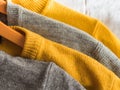 Yellow illuminated color and gray winter sweaters