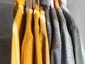 Yellow illuminated color and gray winter sweaters