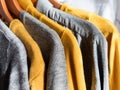 Yellow illuminated color and gray winter sweaters