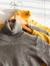 Yellow illuminated color and gray winter sweaters