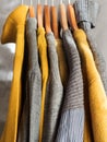Yellow illuminated color and gray winter sweaters