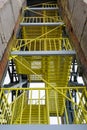 Yellow industrial stairs. Metal, production, mechanical engineering, technologies