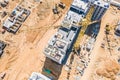 Yellow industrial tower crane at construction site. aerial top view Royalty Free Stock Photo