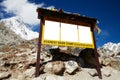 Yellow information board made of wood.