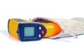 Yellow Infrared thermometer gun used to measure temperature on white background