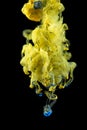 Yellow ink color drop underwater