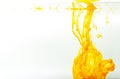 Yellow ink swirling in water, Color drop in water photographed in motion